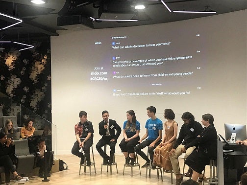 Young people speaking on a panel about children's rights